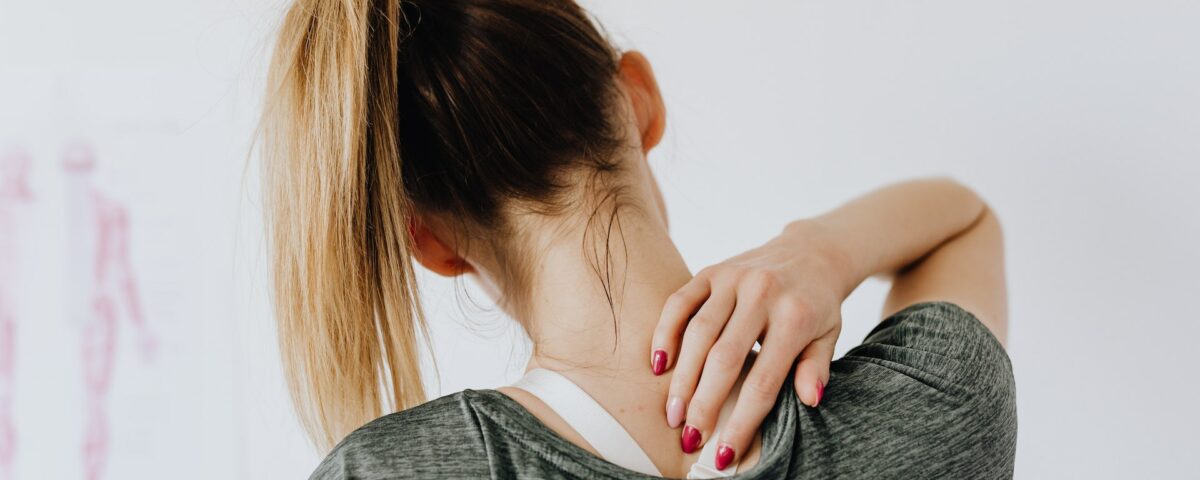 Woman with upper back and necp Pain