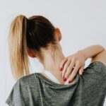Woman with upper back and necp Pain