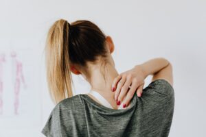 Woman with upper back and necp Pain